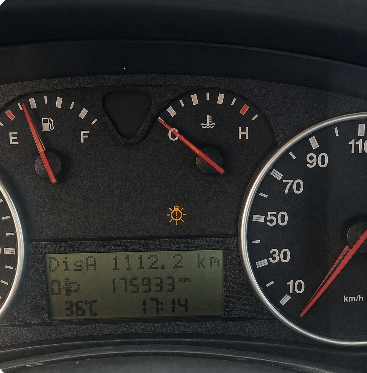 Car dashboard showing fuel consumption data
